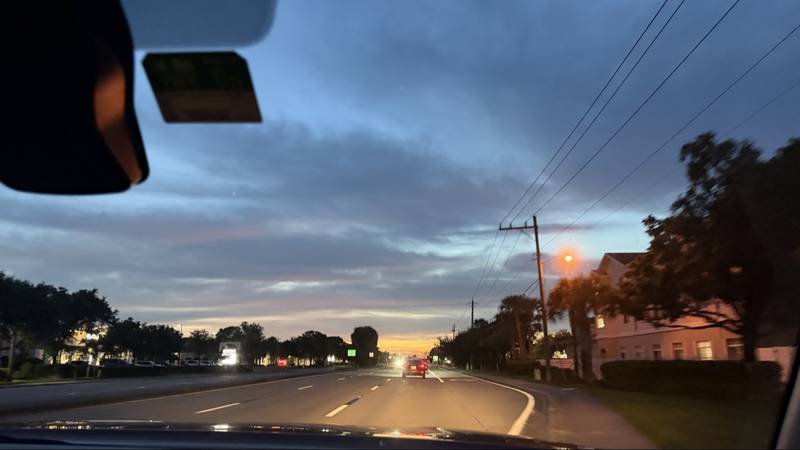 Sunset over a road, the start of a journey
